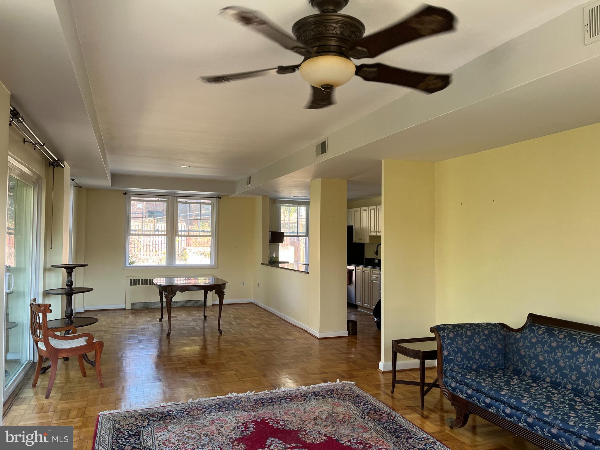 310 Ridgemede Road, Unit 207 Baltimore, MD 21210 - Photo 9 of 32 a living room with furniture and a couch