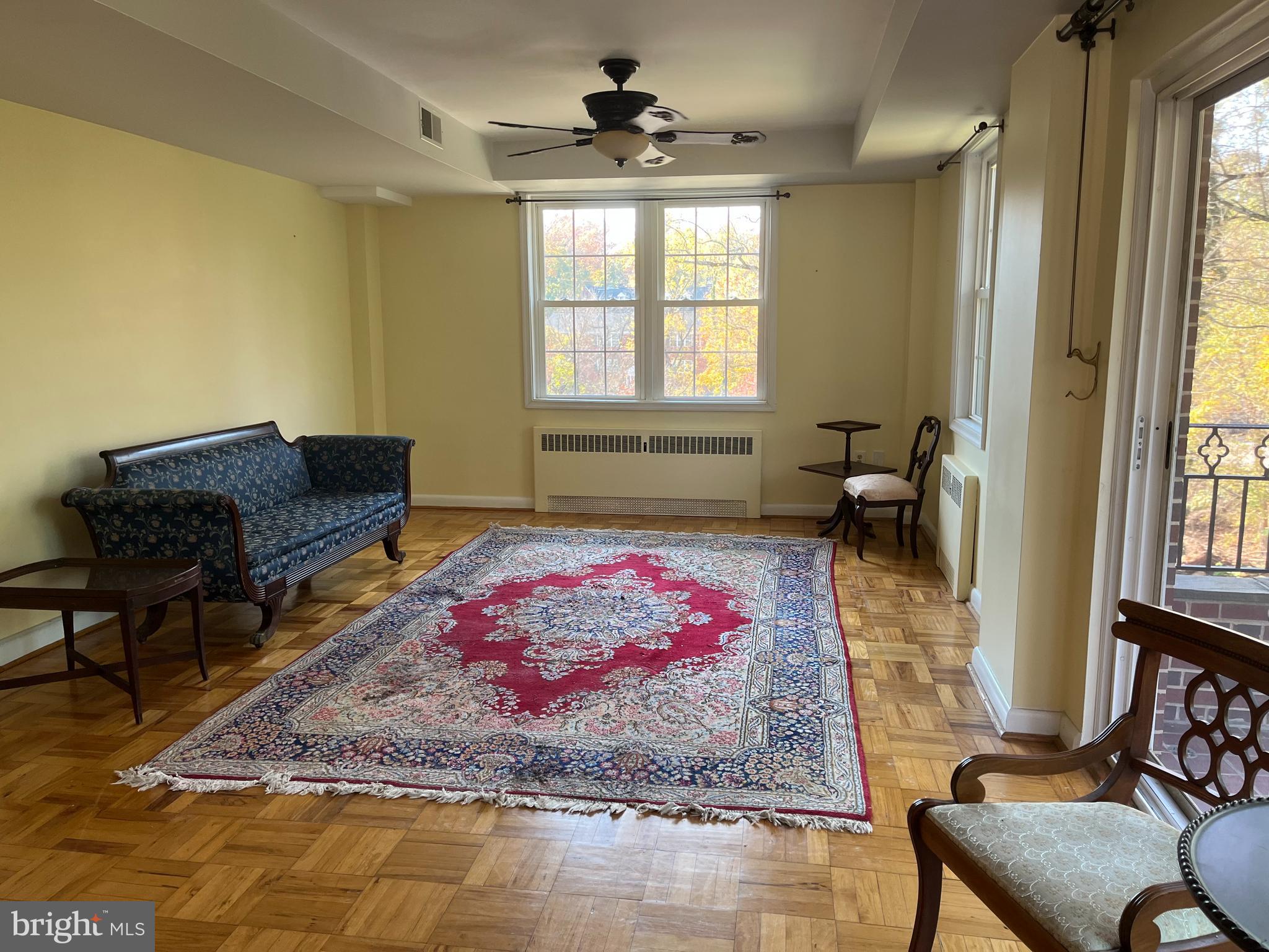 310 Ridgemede Road, Unit 207 Baltimore, MD 21210 - Photo 10 of 32 a living room with furniture and a window