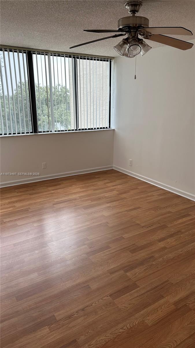 4222 Inverrary Boulevard, Unit 4415 Lauderhill, FL 33319 - Photo 11 of 11 a view of a room with wooden floor and cabinet