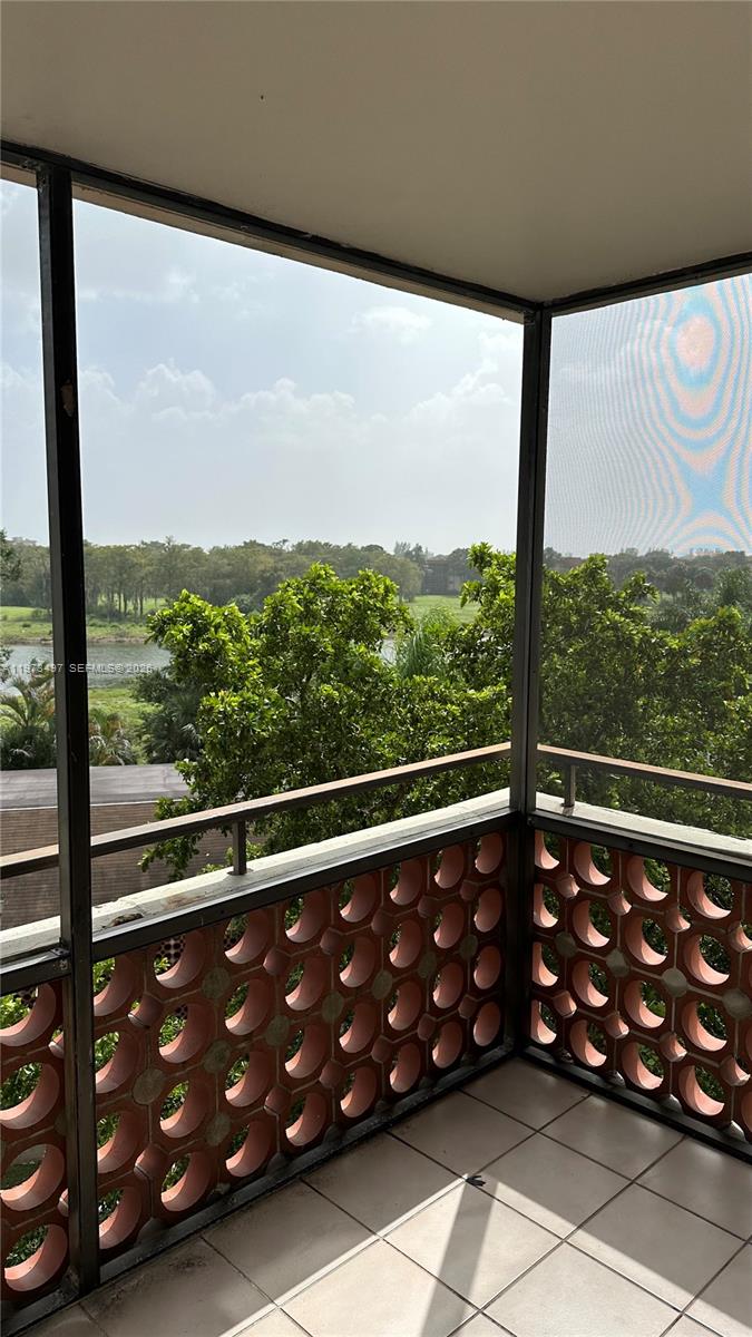 4222 Inverrary Boulevard, Unit 4415 Lauderhill, FL 33319 - Photo 9 of 11 a view of a black and white room with wooden floor
