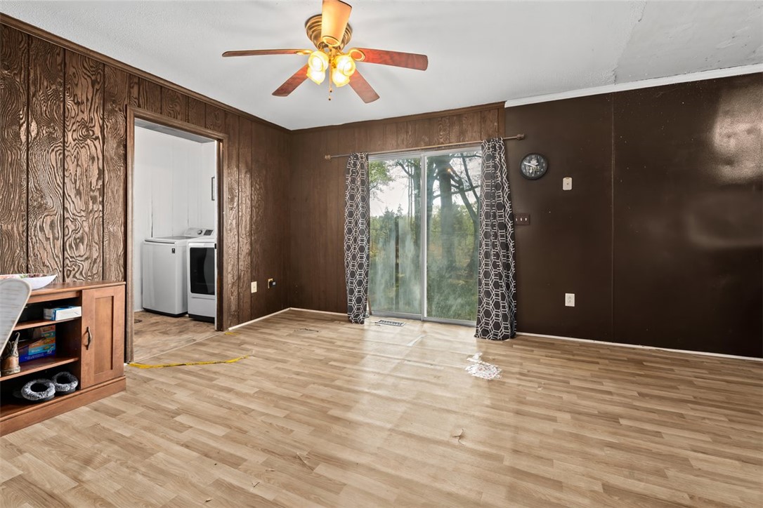 606 County Rd S-1-149 Donalds, SC 29638 - Photo 14 of 38 This living area features durable flooring, offering a comfortable space for everyday living and direct access to the outdoors.