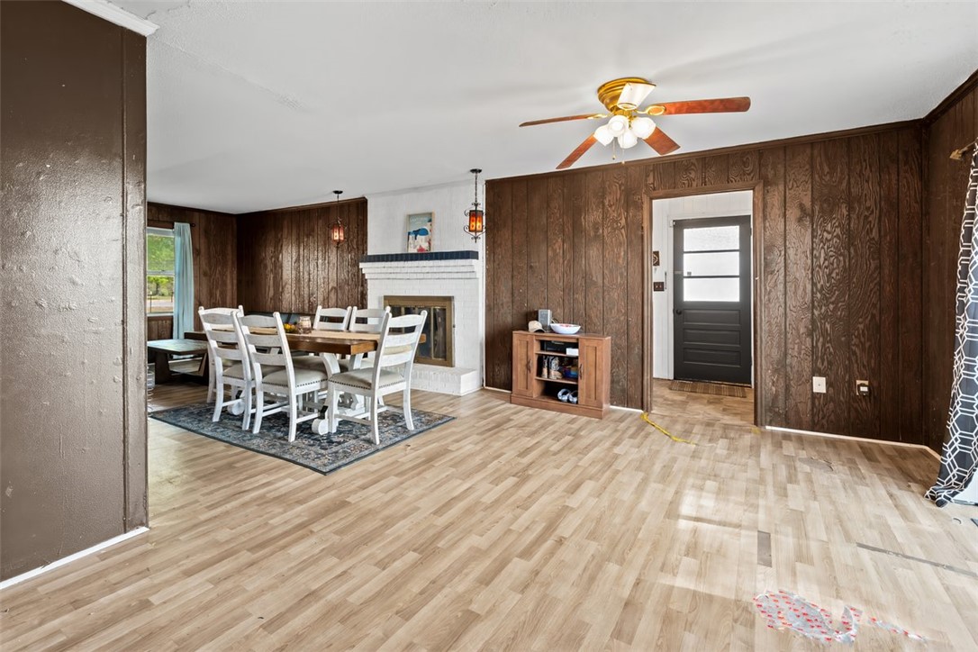 606 County Rd S-1-149 Donalds, SC 29638 - Photo 17 of 38 This inviting dining area features a fireplace and durable wood flooring.
