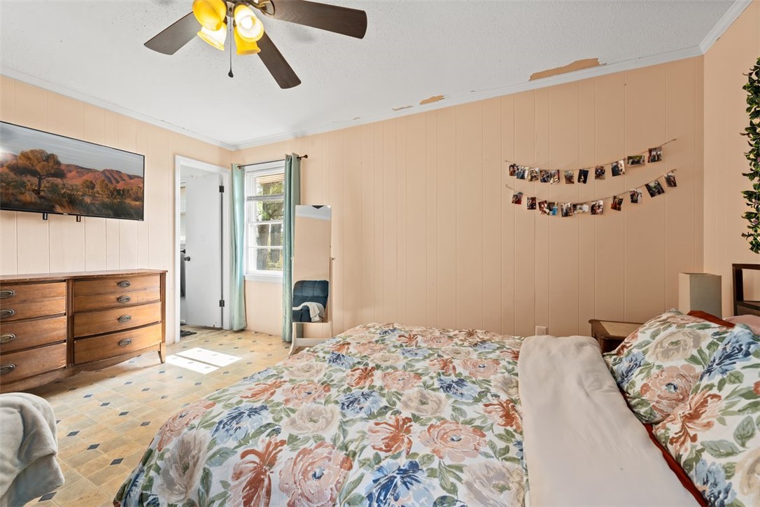606 County Rd S-1-149 Donalds, SC 29638 - Photo 28 of 38 This cozy bedroom features durable vinyl flooring and a ceiling fan, perfect for comfortable living.