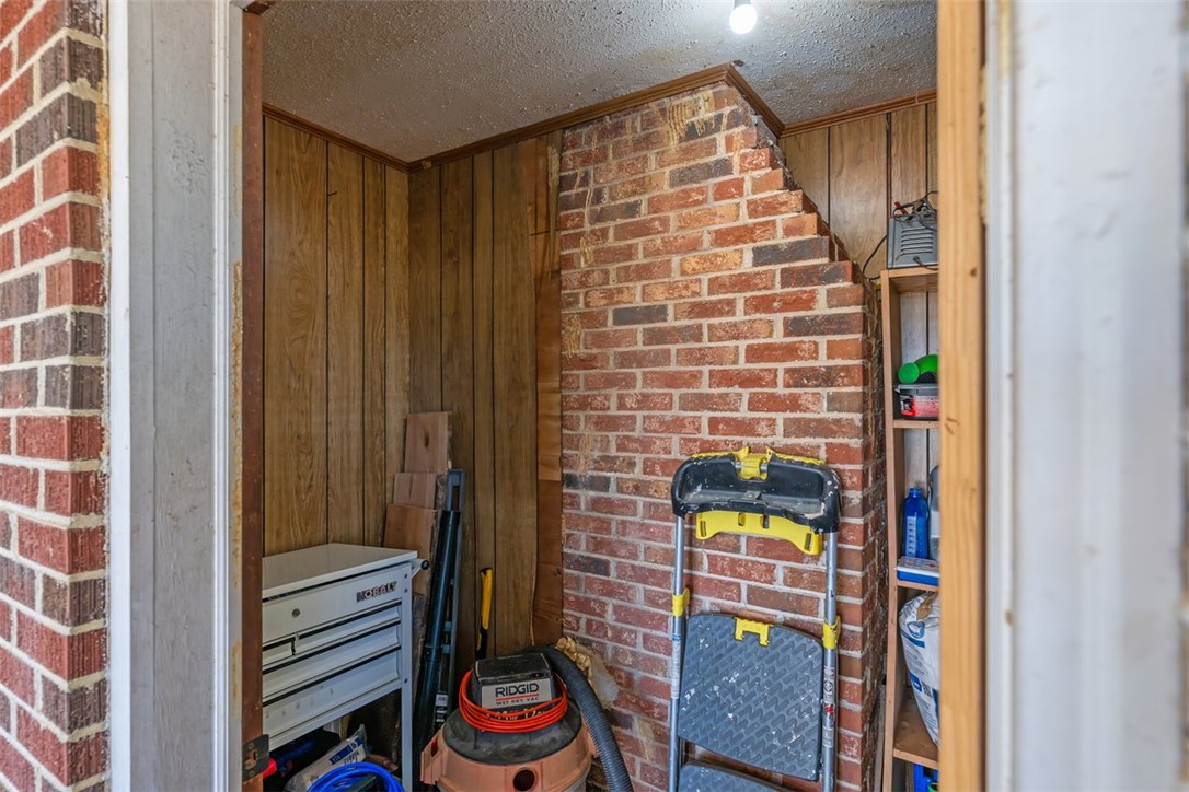 606 County Rd S-1-149 Donalds, SC 29638 - Photo 30 of 38 This storage space features robust brick construction and wood paneling, ideal for organization.
