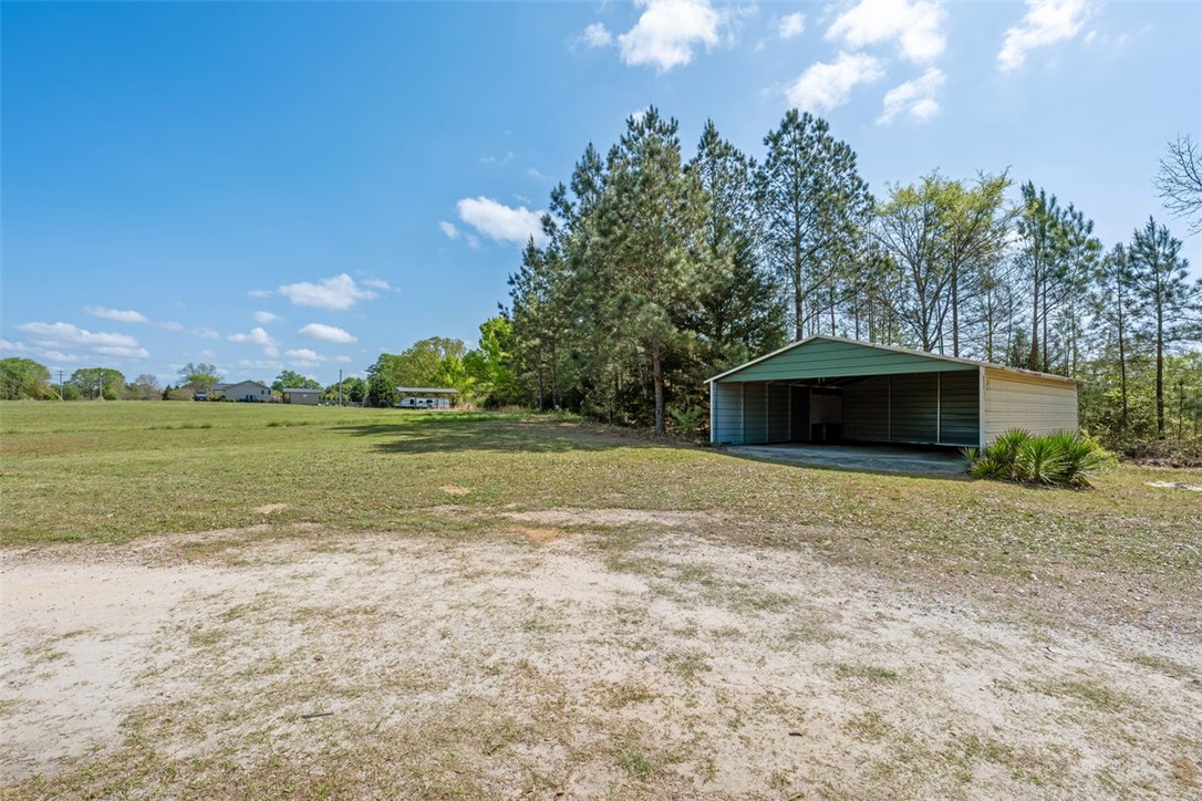606 County Rd S-1-149 Donalds, SC 29638 - Photo 36 of 38 This spacious lot features mature trees and a convenient carport.