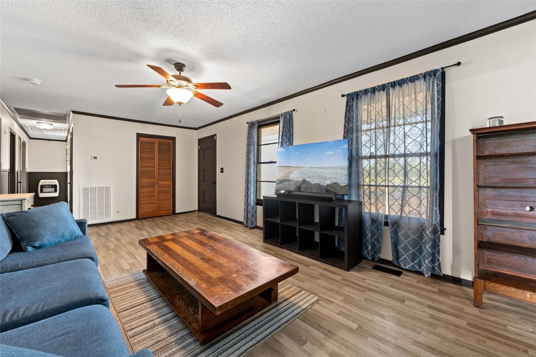 606 County Rd S-1-149 Donalds, SC 29638 - Photo 6 of 38 This inviting living area features durable flooring, offering comfort and style for everyday living.
