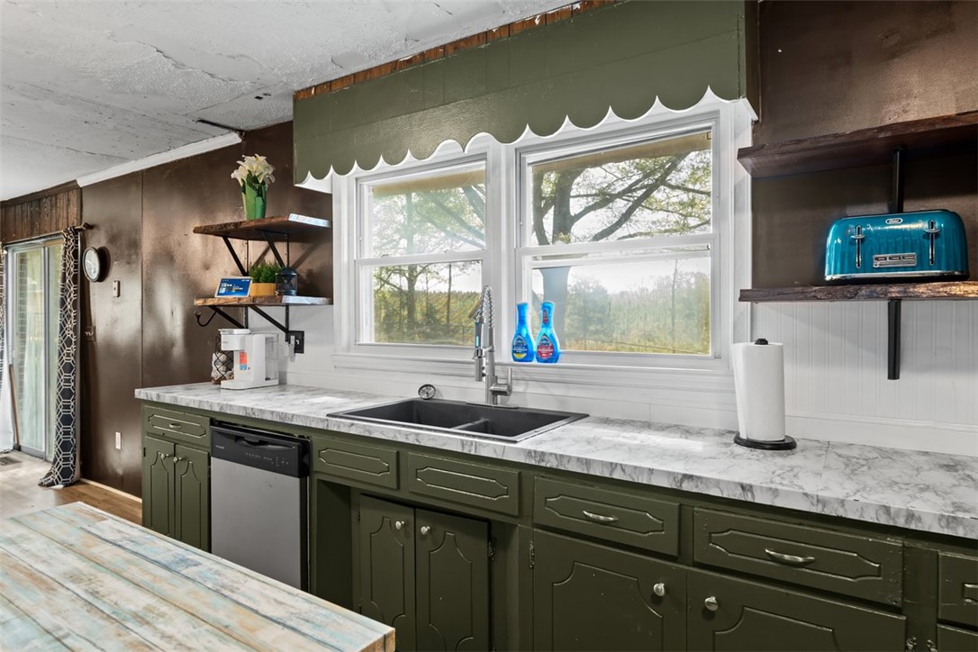 606 County Rd S-1-149 Donalds, SC 29638 - Photo 9 of 38 This kitchen offers a practical layout with ample counter space and a pleasant view.