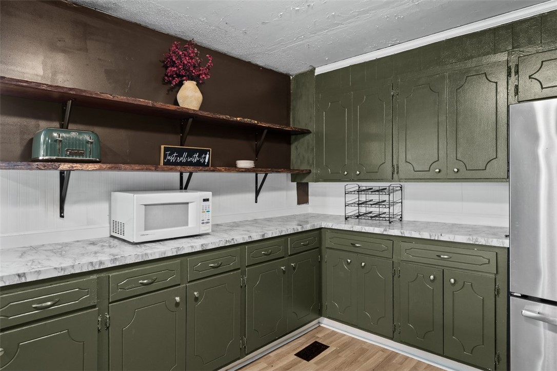 606 County Rd S-1-149 Donalds, SC 29638 - Photo 10 of 38 This charming kitchen offers abundant cabinet storage, perfect for culinary endeavors.