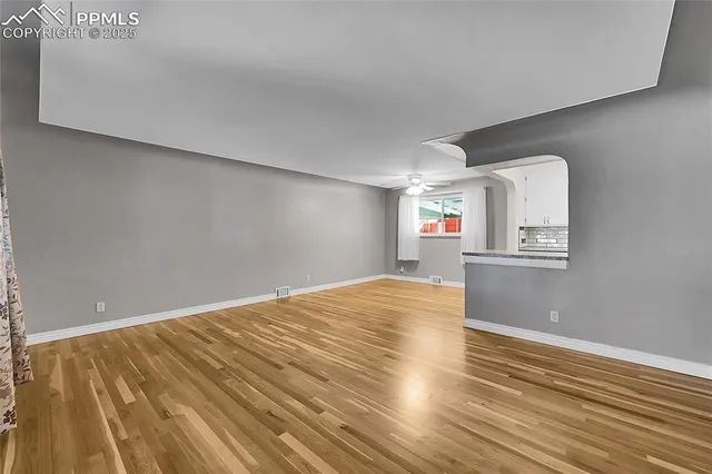 a view of a livingroom with wooden floor