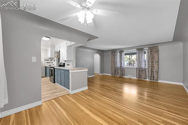 a view of a kitchen with a sink and a window