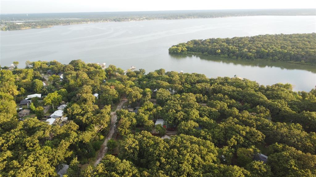 9744 Shady Lane Quinlan, TX 75474 - Photo 6 of 11 a view of a lake with a mountain