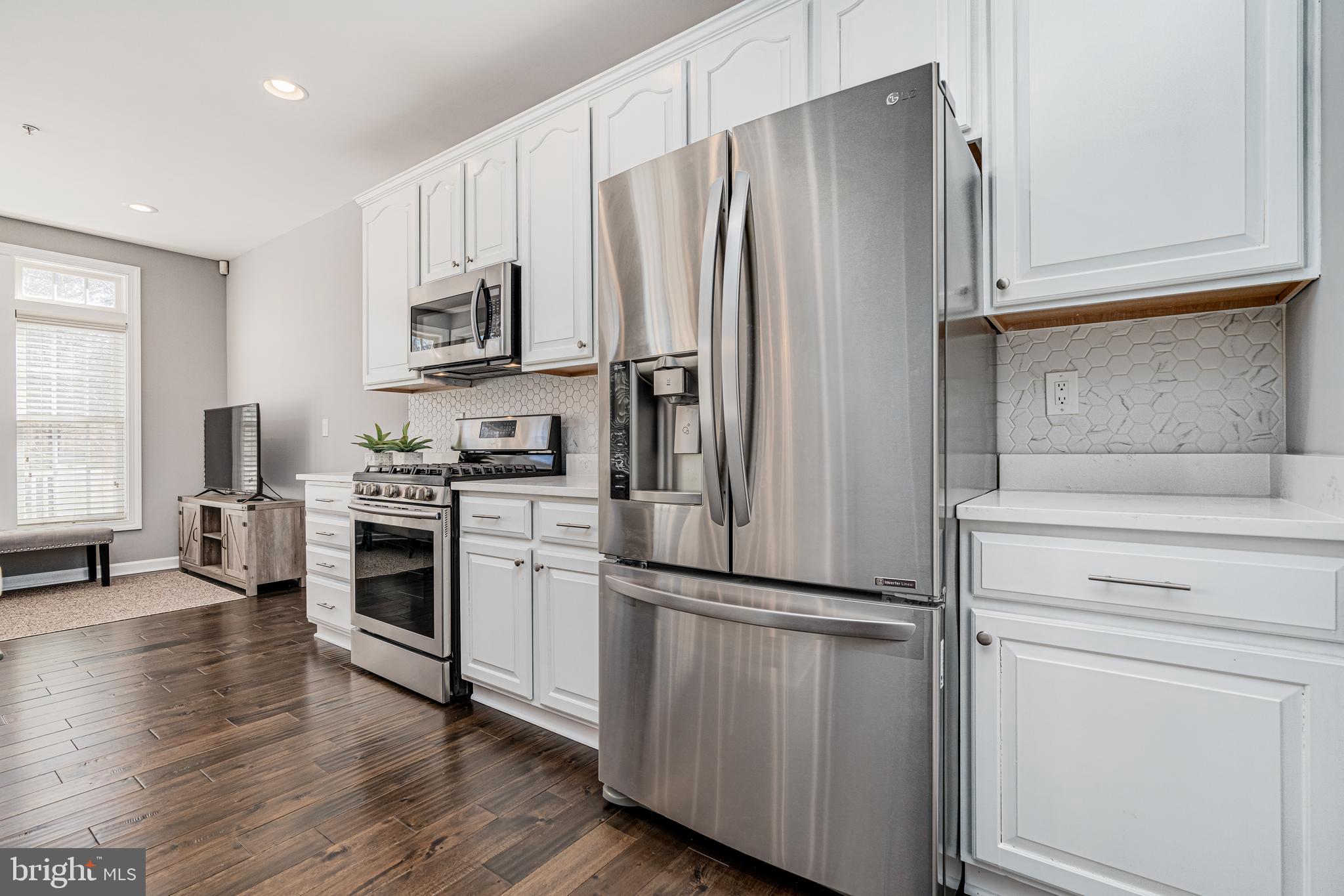 10819 Wadsworth Road Woodstock, MD 21163 - Photo 12 of 52 Newer SS kitchen appliances w/clean Quartz counter