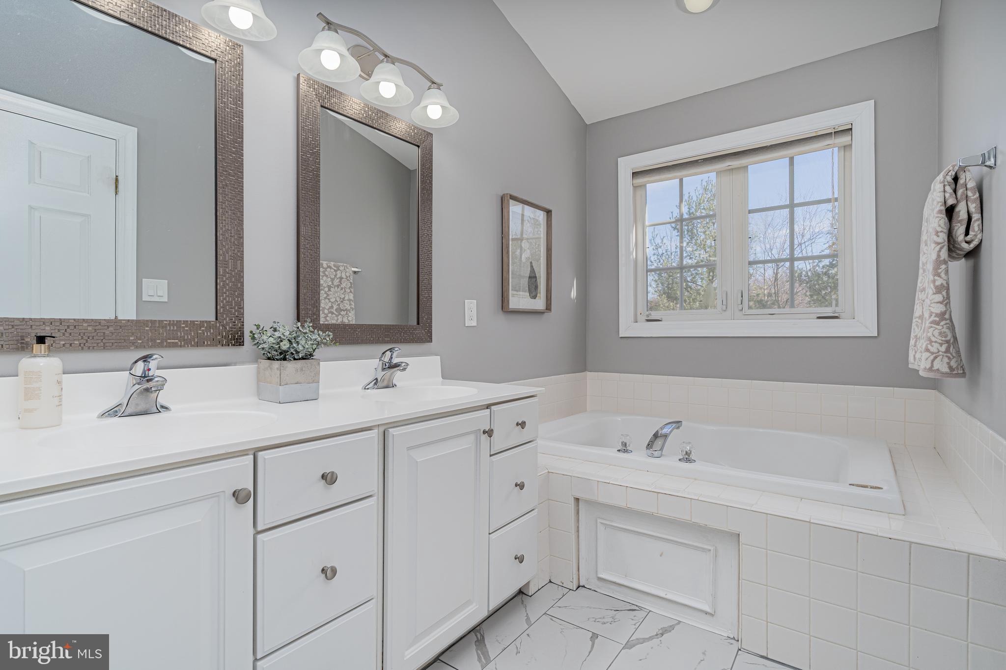 10819 Wadsworth Road Woodstock, MD 21163 - Photo 32 of 52 Master bath w/new floor tiles, lights & mirrors