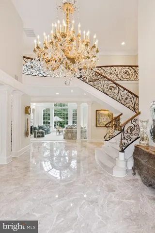 a view of a livingroom with furniture and chandelier