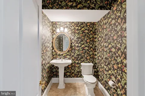 a bathroom with a toilet and a sink