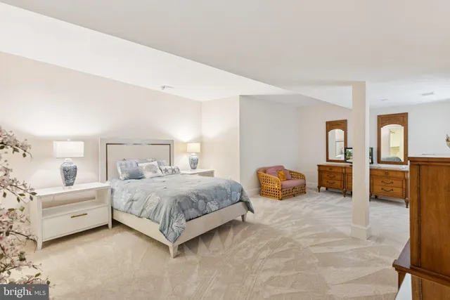 a bedroom with a bed and lamp