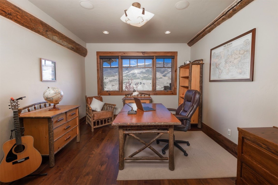 1330 Golden Eagle Road Silverthorne, CO 80498 - Photo 16 of 41 a view of a dining room with furniture window and wooden floor