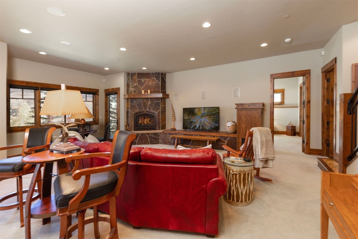 1330 Golden Eagle Road Silverthorne, CO 80498 - Photo 21 of 41 a room with furniture a flat screen tv and a refrigerator