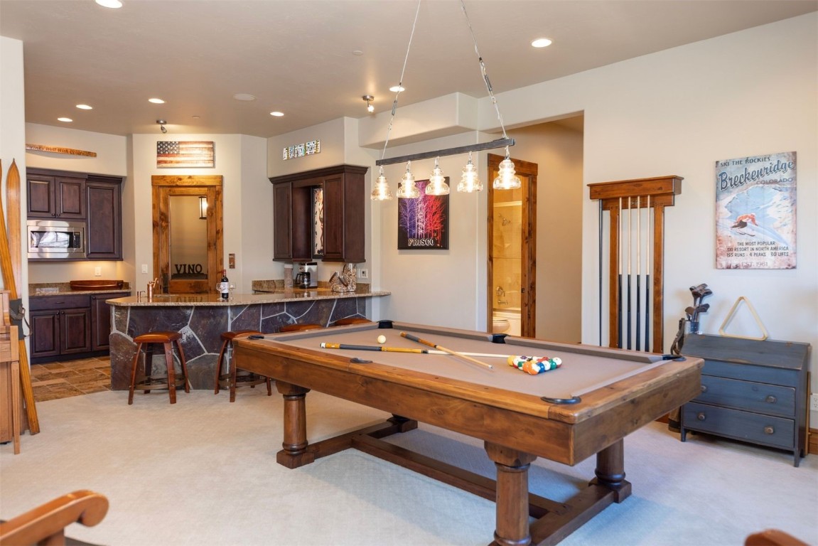 1330 Golden Eagle Road Silverthorne, CO 80498 - Photo 22 of 41 a room with pool table and mirrors