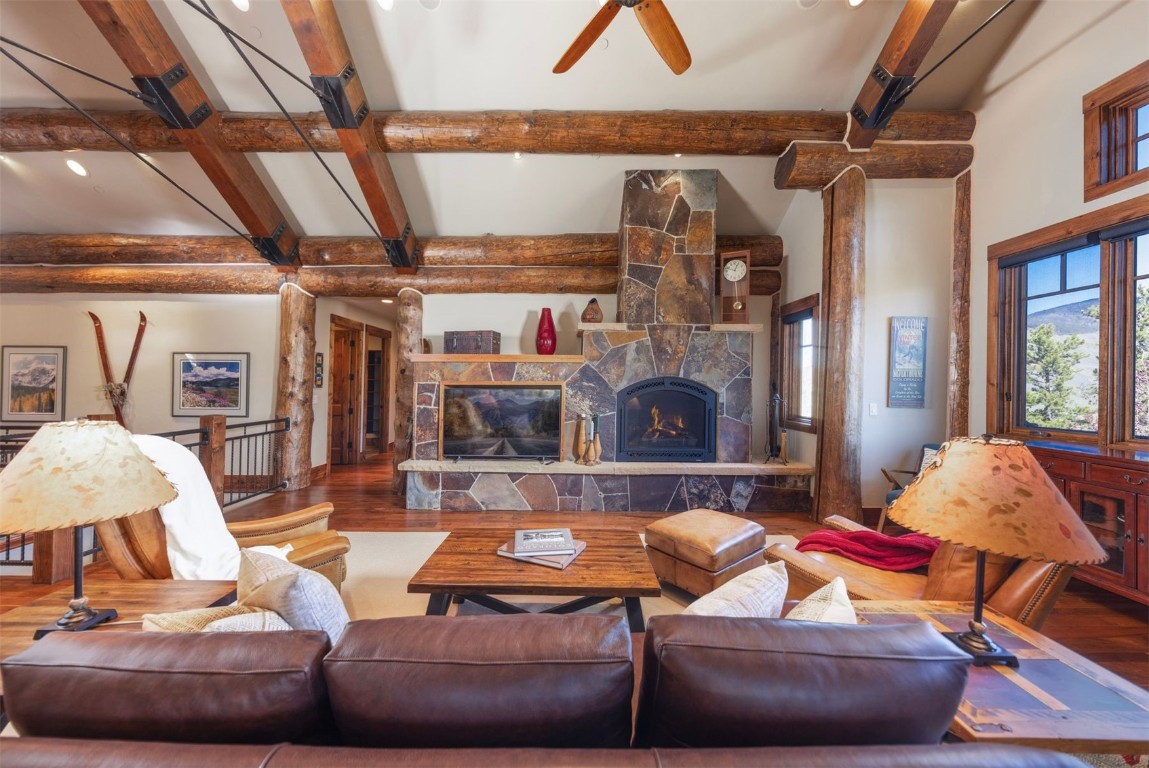 1330 Golden Eagle Road Silverthorne, CO 80498 - Photo 3 of 41 a living room with furniture and a fireplace