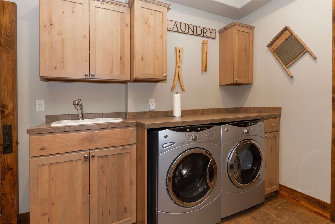 1330 Golden Eagle Road Silverthorne, CO 80498 - Photo 34 of 41 a utility room with dryer and washer