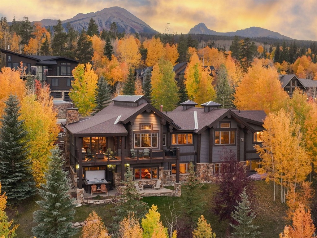 1330 Golden Eagle Road Silverthorne, CO 80498 - Photo 38 of 41 a aerial view of a house with swimming pool and mountains