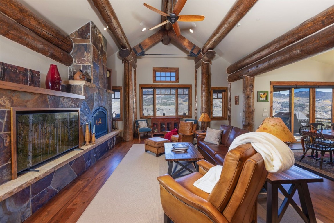 1330 Golden Eagle Road Silverthorne, CO 80498 - Photo 4 of 41 a living room with furniture fireplace and flat screen tv
