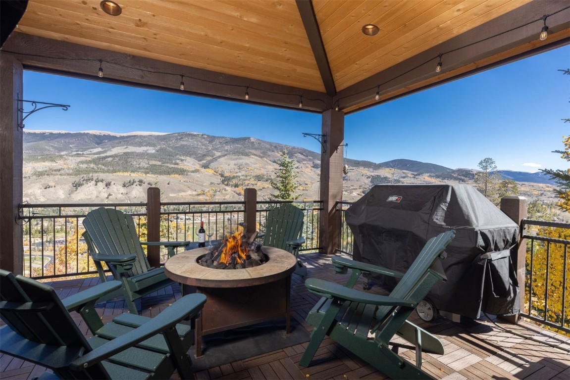 1330 Golden Eagle Road Silverthorne, CO 80498 - Photo 9 of 41 a view of a balcony with chair and wooden floor