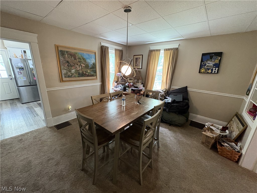 727 Wooster Road North Barberton, OH 44203 - Photo 12 of 37 727 (4-Bed) - Open room with neutral-toned walls featuring chair rail molding