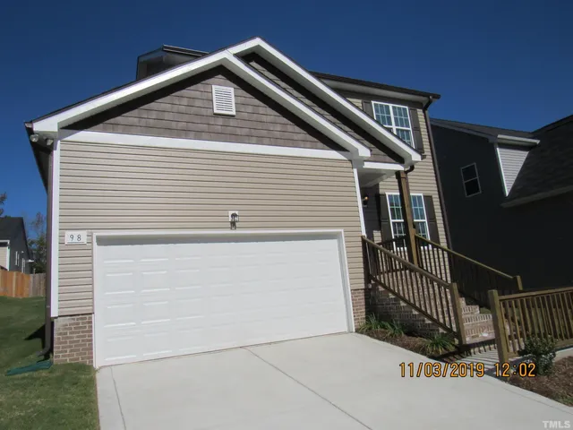 a view of house with yard