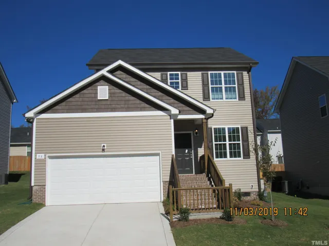 a kitchen with a refrigerator and a sink