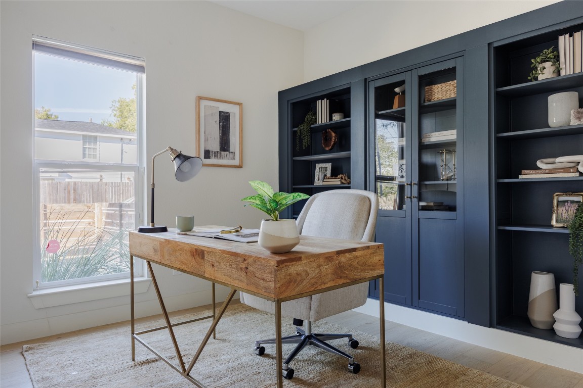 1205 McKinley Avenue Austin, TX 78702 - Photo 13 of 34 a workspace with furniture and window