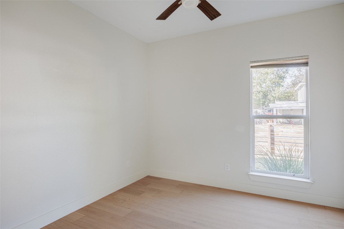 1205 McKinley Avenue Austin, TX 78702 - Photo 16 of 34 an empty room with ceiling fan and window