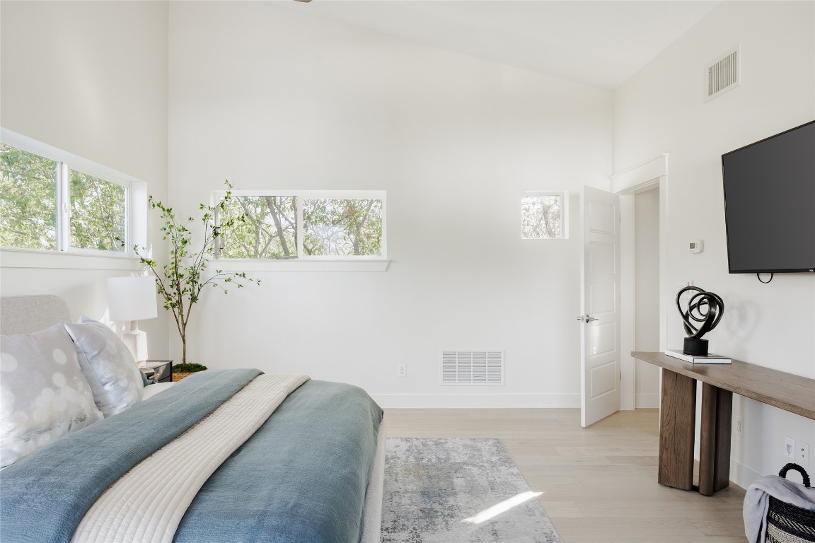 1205 McKinley Avenue Austin, TX 78702 - Photo 22 of 34 a bedroom with a bed and a flat screen tv
