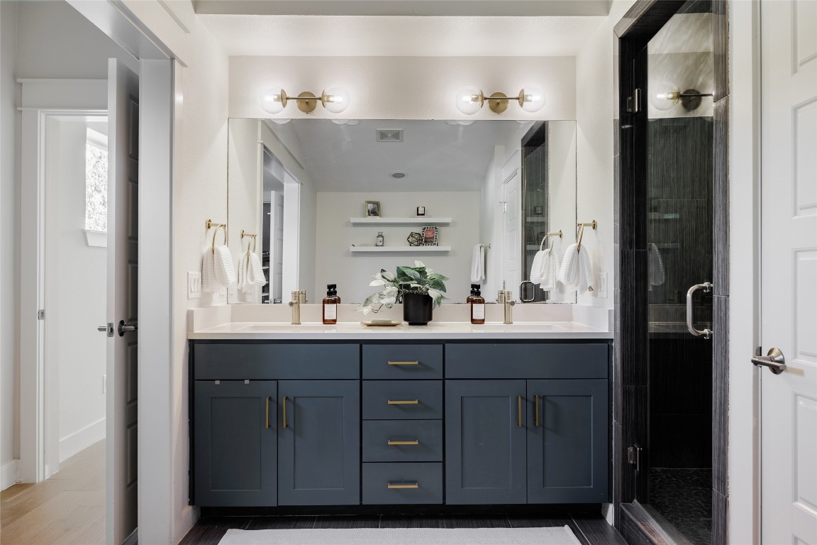 1205 McKinley Avenue Austin, TX 78702 - Photo 23 of 34 a bathroom with a sink and mirror