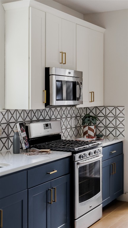 1205 McKinley Avenue Austin, TX 78702 - Photo 34 of 34 a kitchen with granite countertop white cabinets and stainless steel appliances