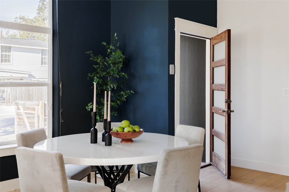 1205 McKinley Avenue Austin, TX 78702 - Photo 4 of 34 a view of a dining room with furniture window and wooden floor