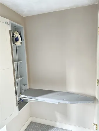 a view of a room with rack on the wall