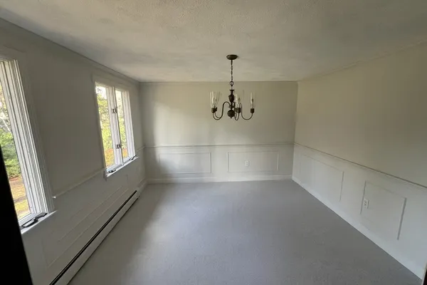 a view of empty room with windows