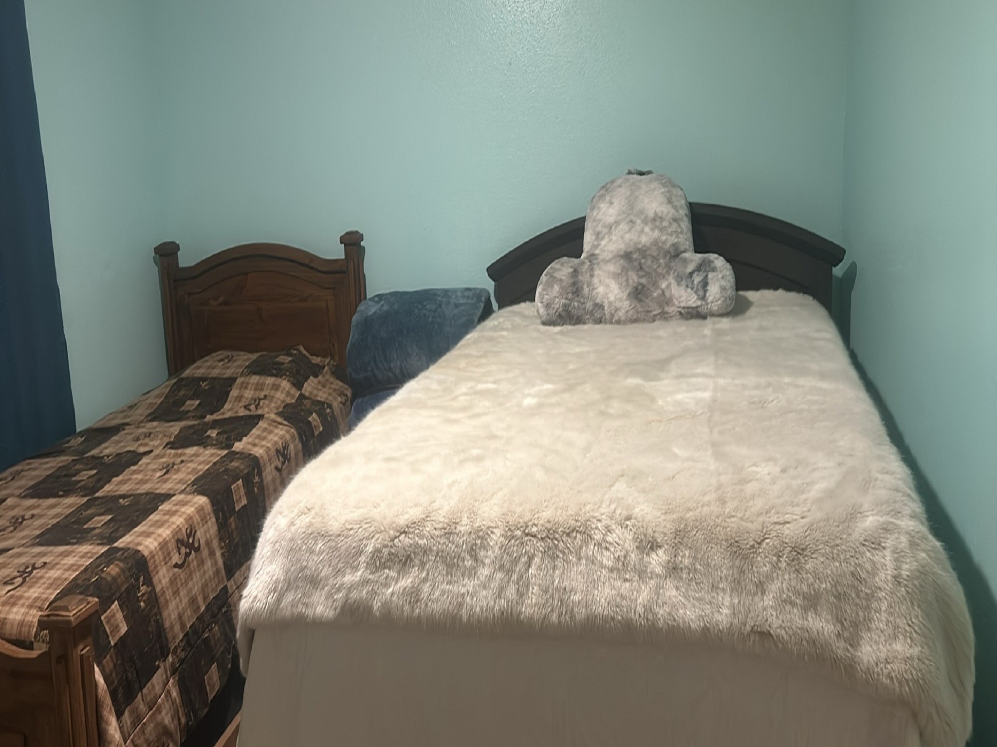 9810 Fernstone Lane Houston, TX 77070 - Photo 7 of 14 a large bed sitting in a bedroom next to a window