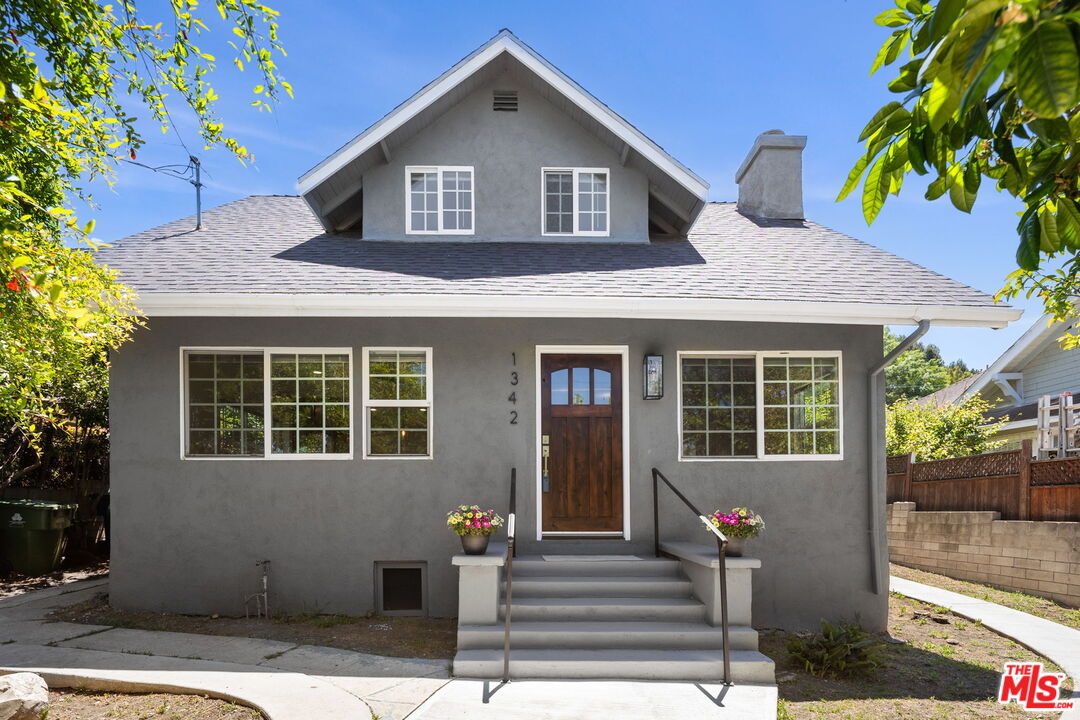 1342 Mohawk Street Los Angeles, CA 90026 - Photo 1 of 29 a front view of a house with garden
