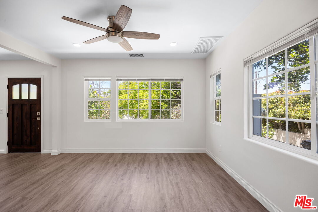 1342 Mohawk Street Los Angeles, CA 90026 - Photo 12 of 29 a view of room with window ceiling fan and hardwood floor