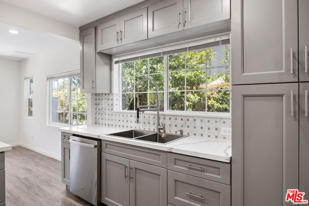 1342 Mohawk Street Los Angeles, CA 90026 - Photo 16 of 29 a kitchen with granite countertop a window and a sink