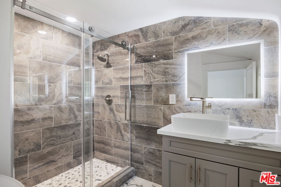 1342 Mohawk Street Los Angeles, CA 90026 - Photo 26 of 29 a bathroom with a sink and a mirror