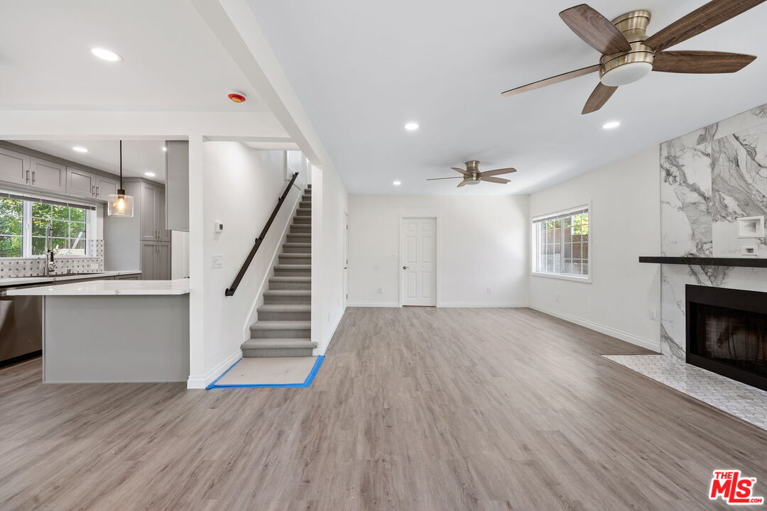 1342 Mohawk Street Los Angeles, CA 90026 - Photo 5 of 29 wooden floor in an empty room with a fireplace