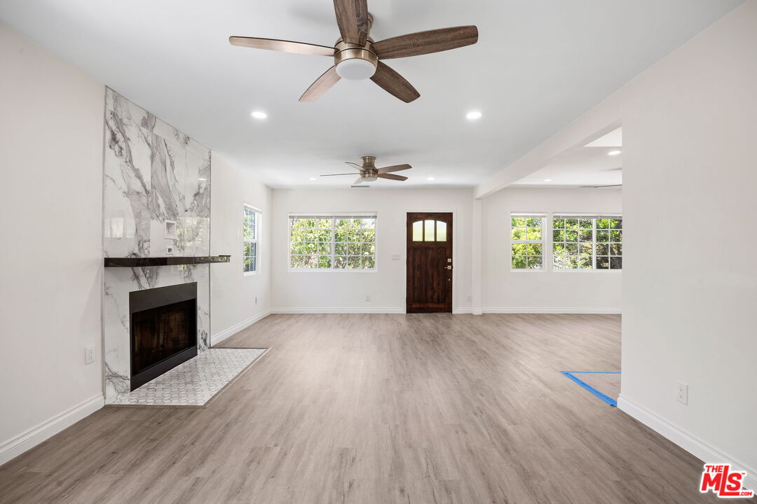 1342 Mohawk Street Los Angeles, CA 90026 - Photo 9 of 29 an empty room with windows and fireplace