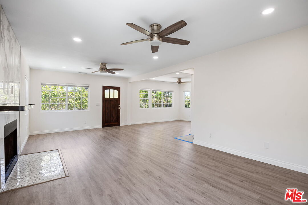 1342 Mohawk Street Los Angeles, CA 90026 - Photo 10 of 29 a view of an empty room with a window and wooden floor