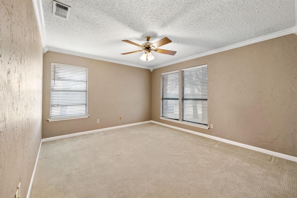 7260 Hudson Cemetery Road Mansfield, TX 76063 - Photo 26 of 40 Spacious room featuring carpet flooring, two windows with blinds, a ceiling fan with light fixture, and white crown molding