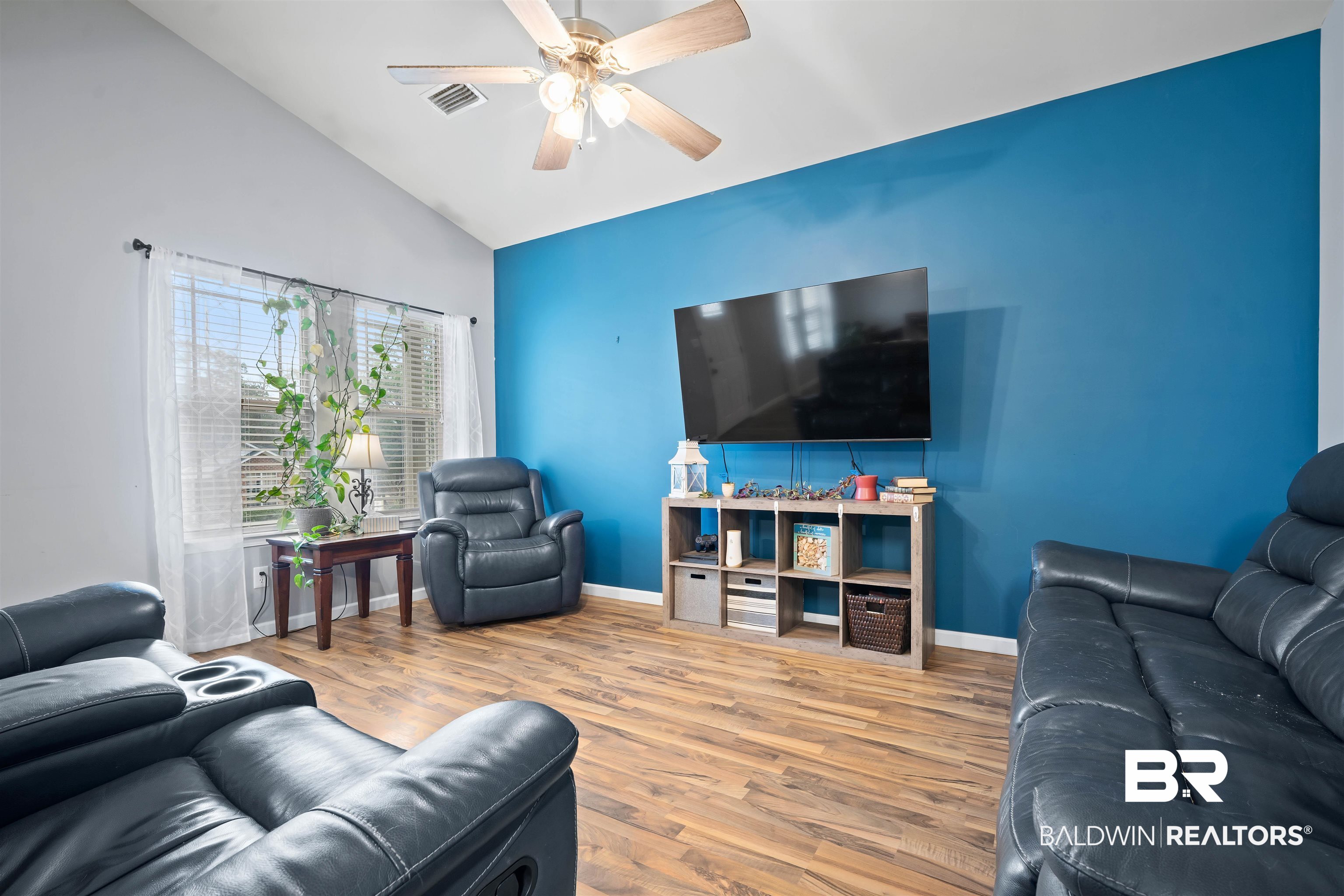 209 Maplewood Loop Daphne, AL 36526 - Photo 4 of 23 Living room with wood finished floors, a ceiling fan, and vaulted ceiling
