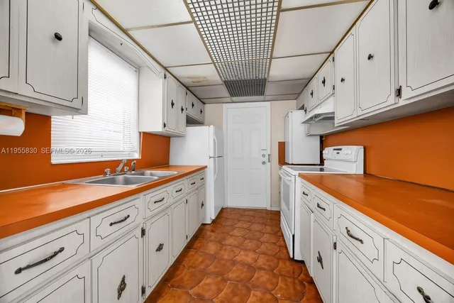 a large kitchen with cabinets